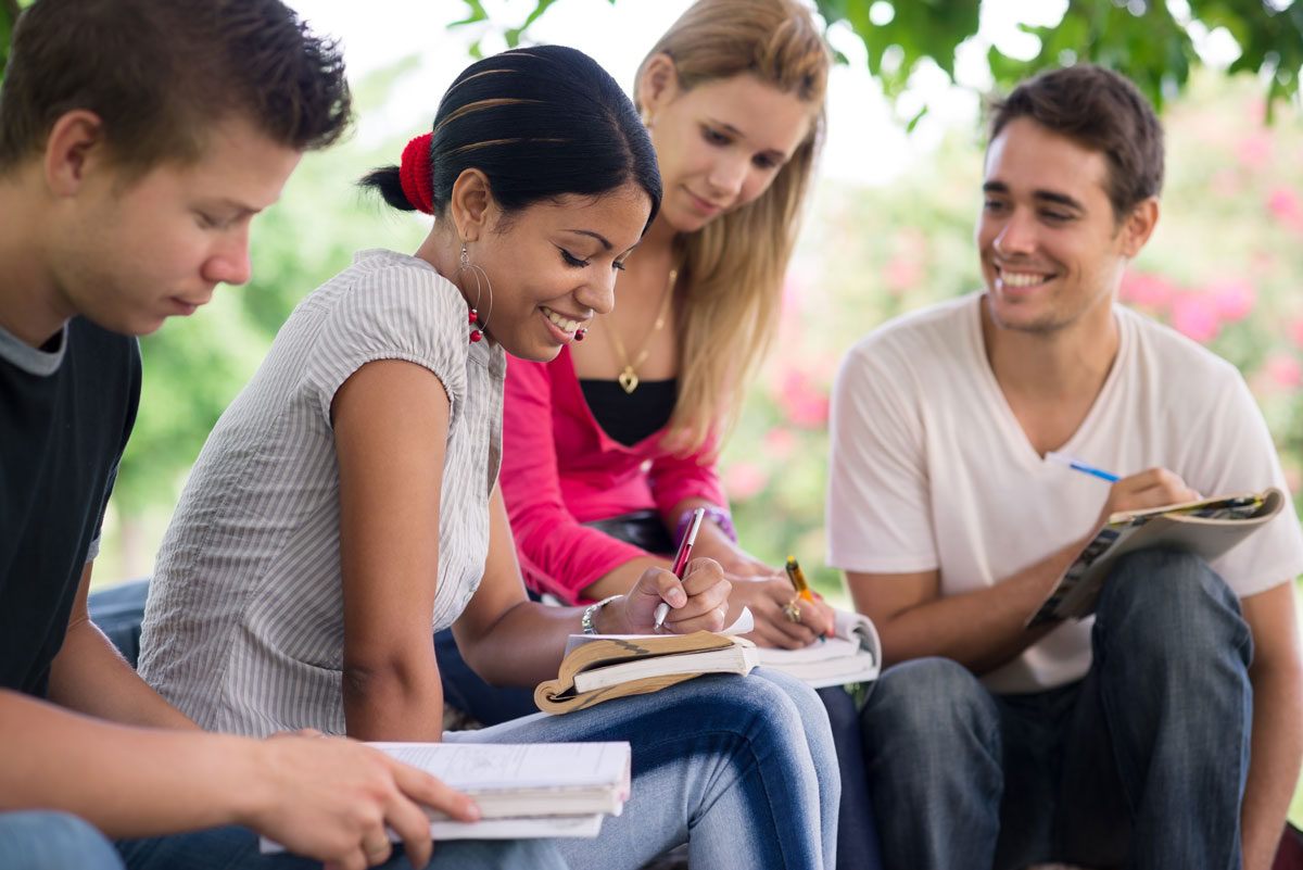 A-Level students discussing maths problems together